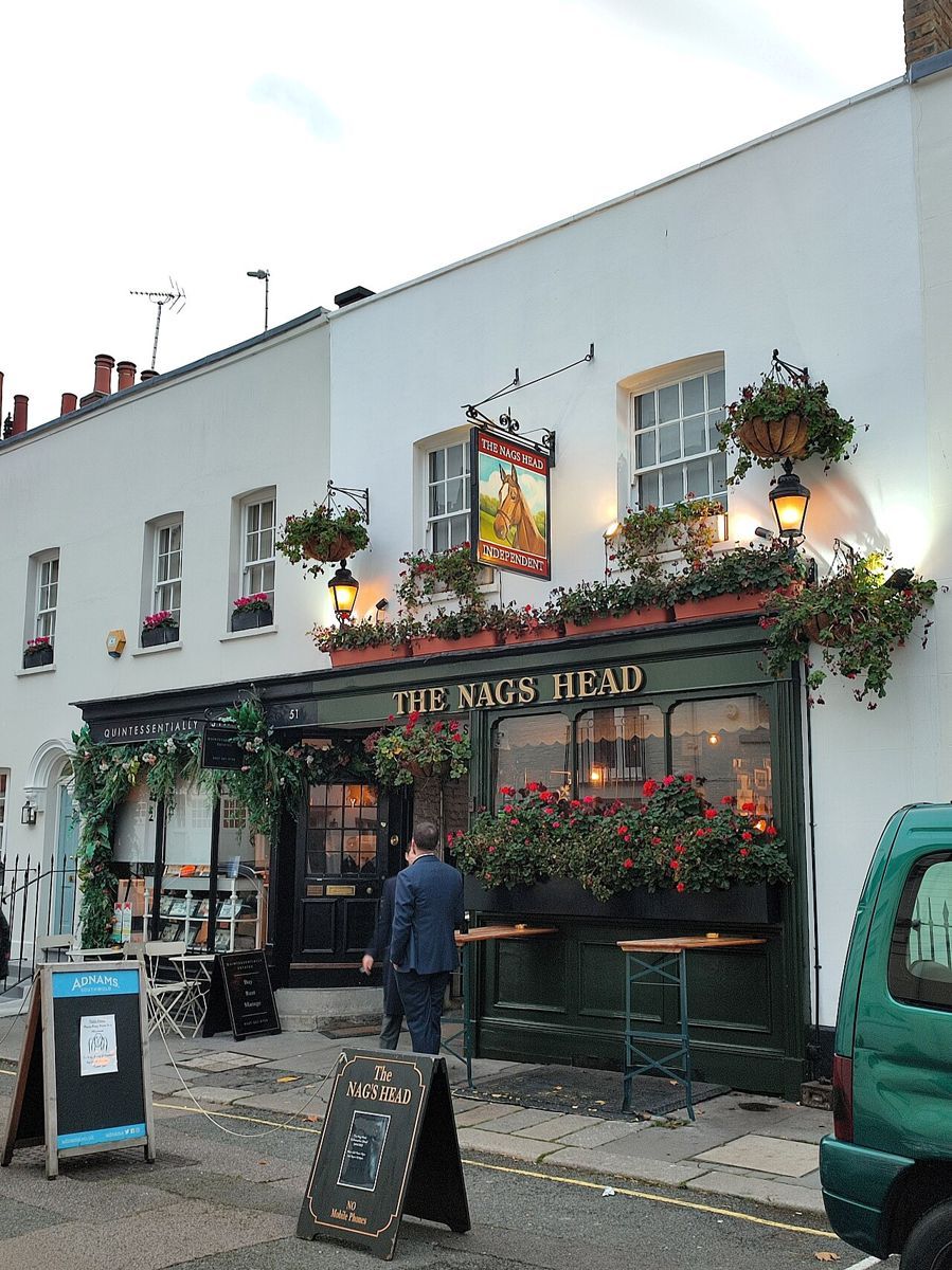 The Nag's Head, a tiny Belgravia pub crammed with vintage bric-a-brac and penny slots, with the lowest bar counter